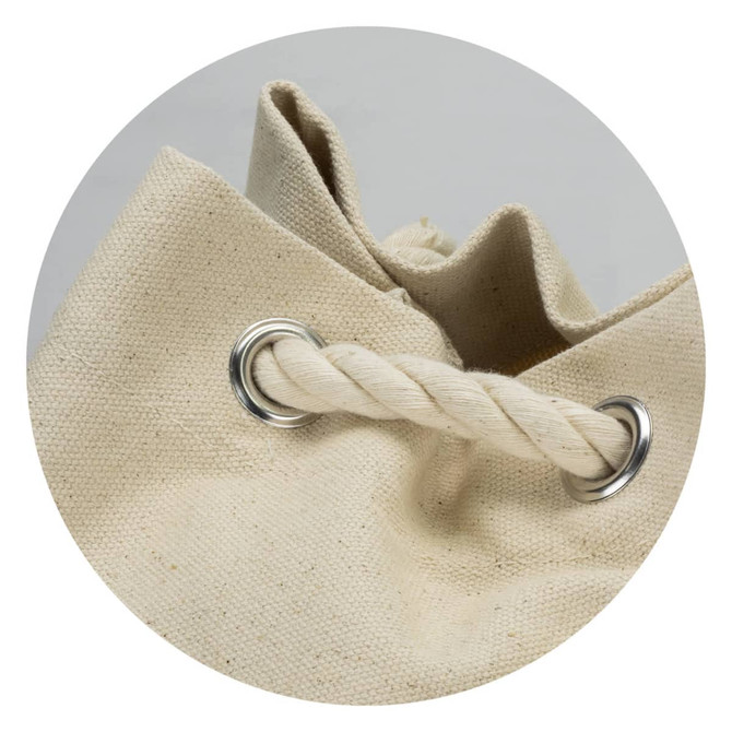 A beige canvas barrel bag with metal eyelets and a twisted rope handle, featuring a simple, unadorned design.
