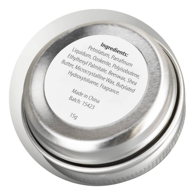 A silver lip balm tin with a round shape, showing a label with ingredient details on the top.