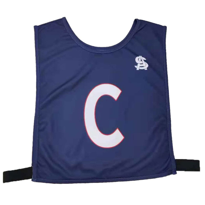 A navy netball bib featuring the letter 'C' in white, with a logo on the upper left. Elastic straps included.