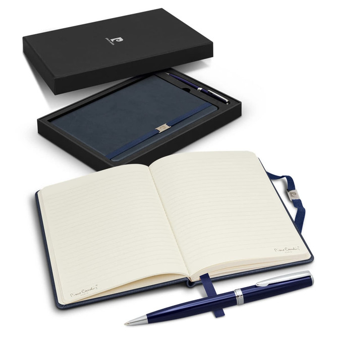 A navy blue notebook with lined pages and a matching pen, presented in a sleek black gift box.