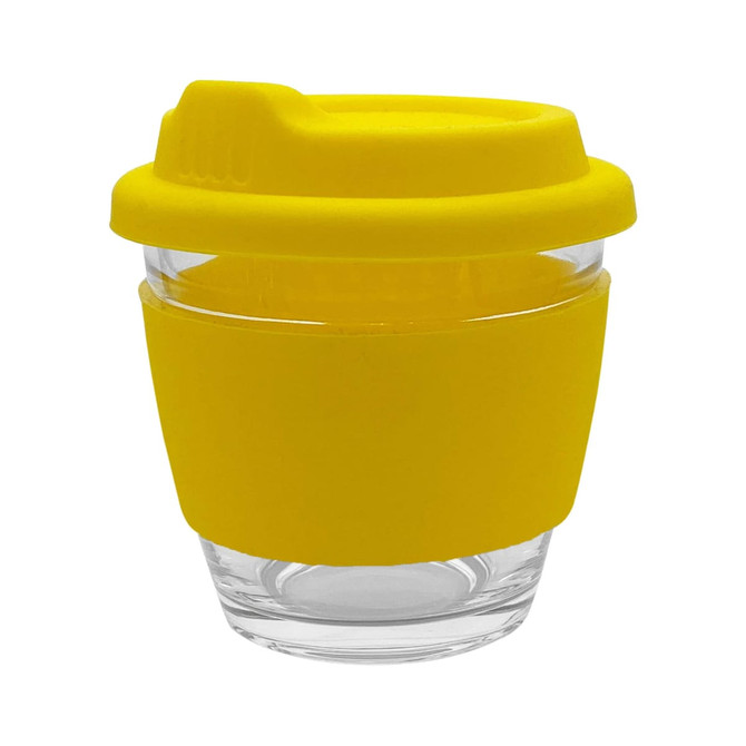 A yellow reusable coffee cup with a silicone sleeve and lid, featuring a transparent glass body.