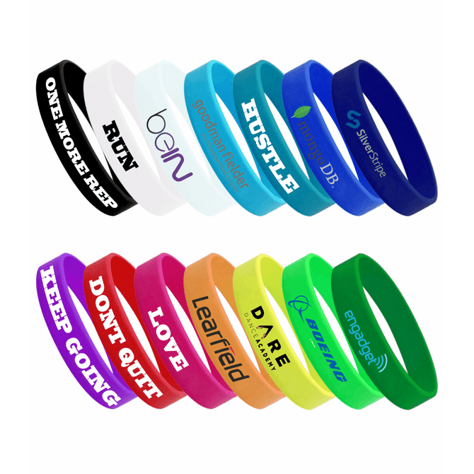 A collection of silicone wristbands in various colours such as blue, green, orange, black, and white, featuring different logos.