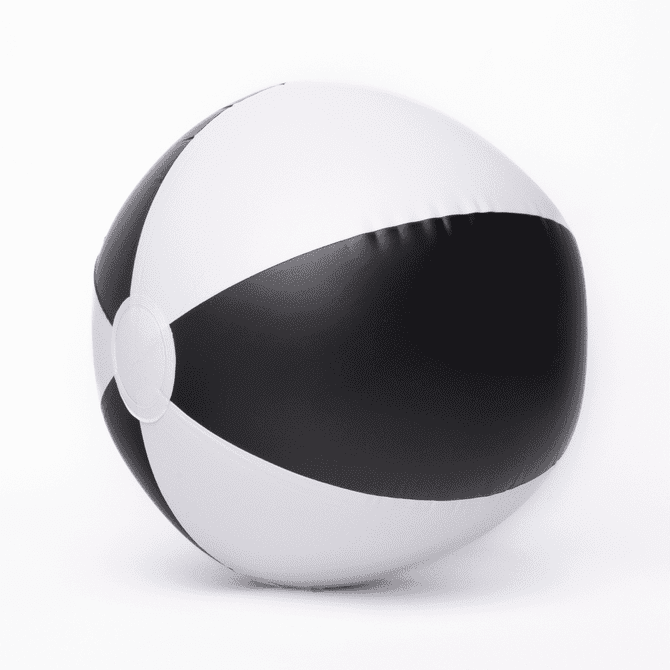 A beach ball with black and white segments, featuring a smooth, inflatable surface and a circular design.