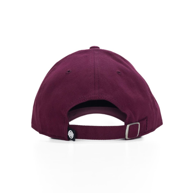 A burgundy cap featuring a rear strap adjustment and a logo on the side.