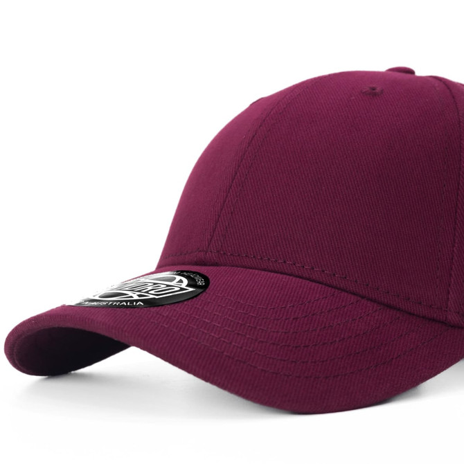 A burgundy cap with a curved brim and a branded patch on the front.