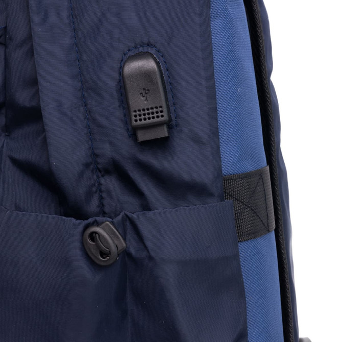 A navy backpack featuring a black zipper pull and a side attachment point. It has a textured fabric design.