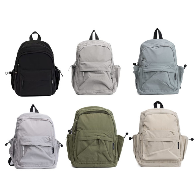 A collection of six Mono Backpacks in black, grey, light grey, olive green, and cream, featuring various pockets and a logo.