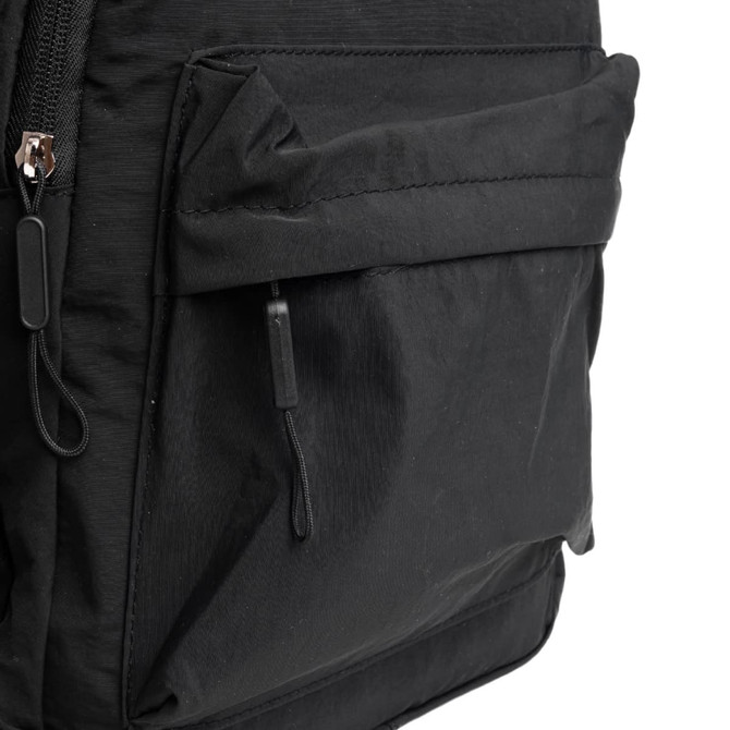 A black backpack with a front pocket and zipper details, featuring a simple, functional design and a logo.