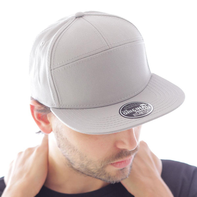 A grey cap with a flat peak, featuring a branded logo on the front.