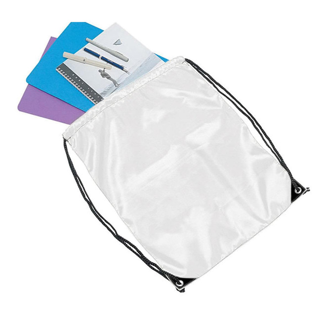 A white drawstring bag containing assorted items, including colourful notebooks. The bag features a logo.