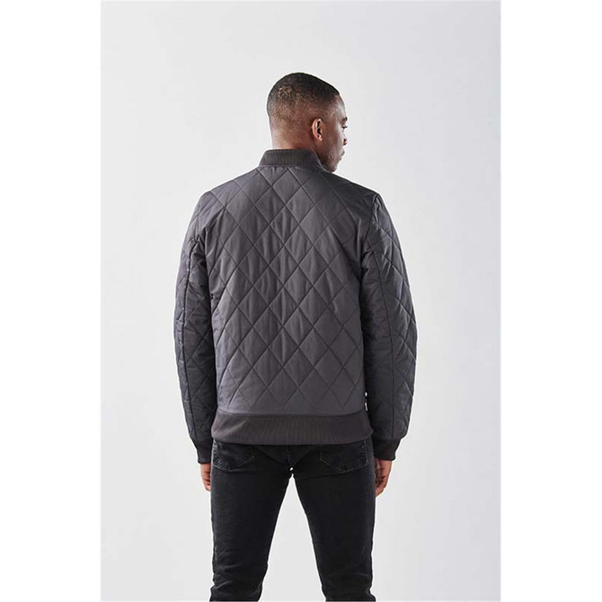 A men's quilted thermal jacket in dark grey, featuring a simple design and a logo on the back.