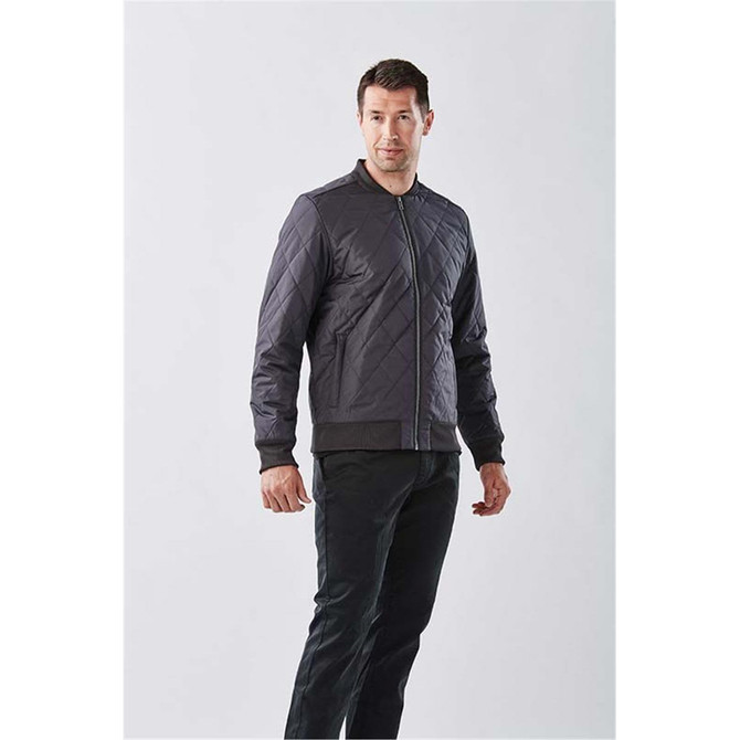 Men's Oakland Thermal Jacket in dark grey, featuring a zip front and quilted design. Includes a logo on the jacket.