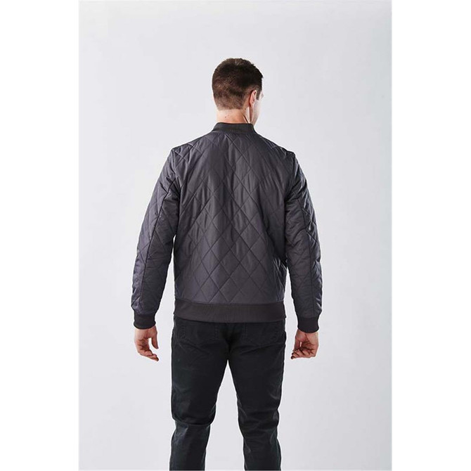 A men's thermal jacket in dark grey with a quilted design, featuring a ribbed hem and cuffs, viewed from behind.