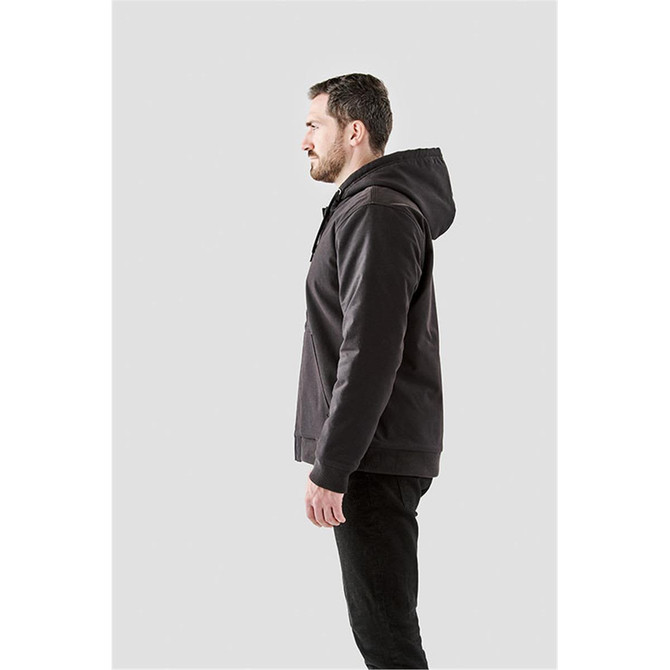 A men's hoodie in charcoal grey, featuring a hood and a logo, shown from the side on a model.