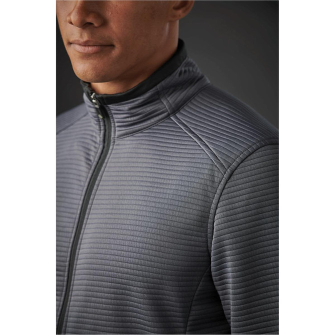 A close-up of a man's grey Andorra jacket with a textured quilted design and a zip-up collar.