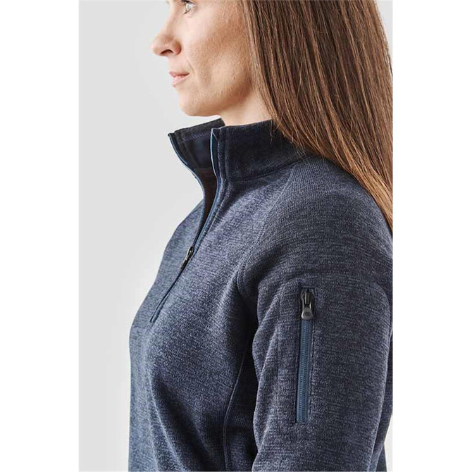 A navy women's pullover with a 1/4 zip, featuring a zippered pocket on the sleeve and a sleek design.