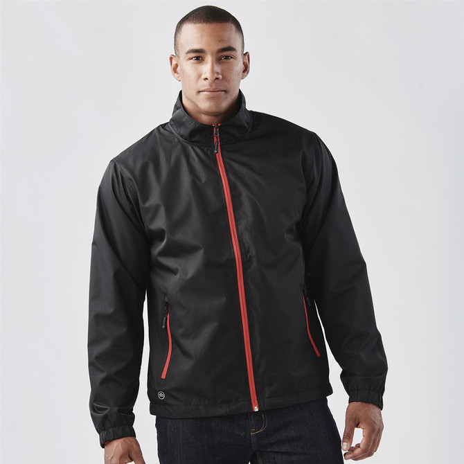 A black jacket with red zip and accents, featuring a logo, displayed on a model.