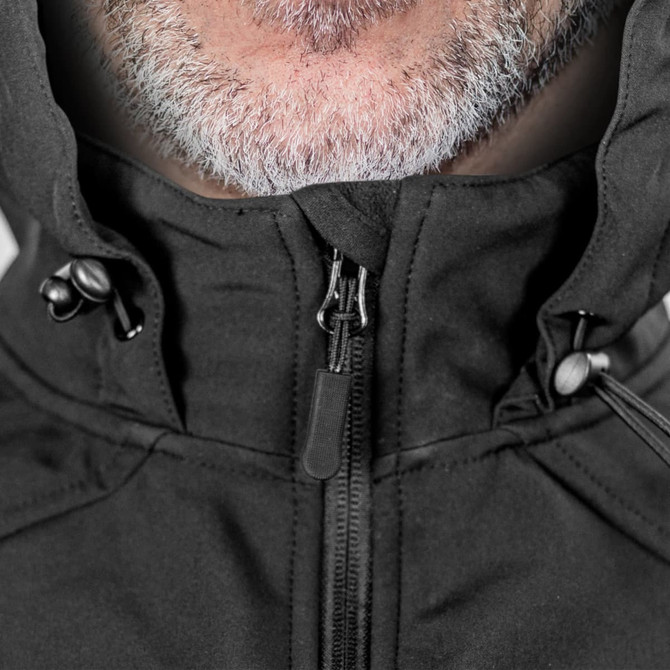 A black soft shell jacket with a zip closure and adjustable hood, featuring a branding logo.