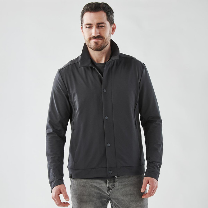 A men's Soho jacket in black, featuring a collared design and a button front, worn by a model.