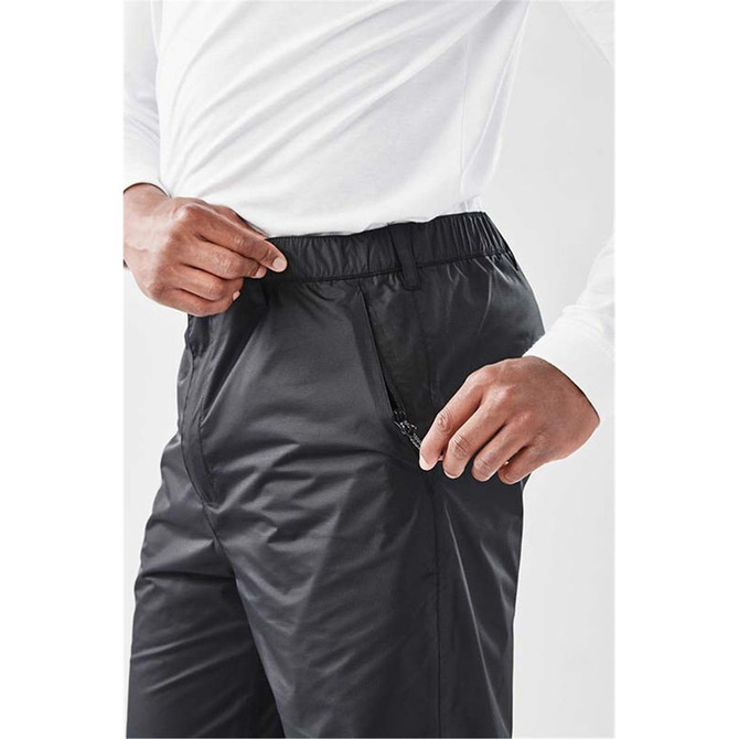 Men's Olympia Rain Pant in black, featuring an elastic waistband and a side zip pocket, with a person wearing them.