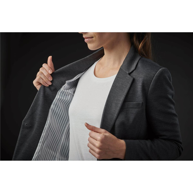 A women's grey Delano knit blazer with a striped lining, held open to display its interior.
