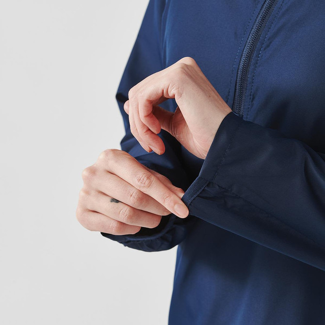A navy blue women's rain jacket with a quarter zip and adjustable cuffs. Features a logo on the fabric.