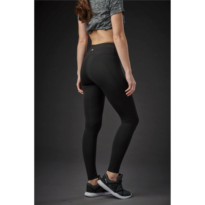 A pair of black women's leggings with a high waist, displayed on a model from a rear angle against a dark background.