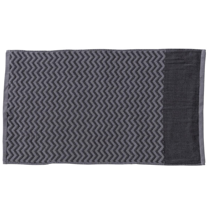 A grey gym towel featuring a textured zigzag pattern and a convenient pocket. It has a logo in one corner.