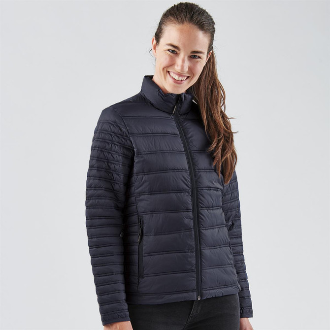 A women's black jacket featuring a zip front and padded design, with a branding logo on the chest.