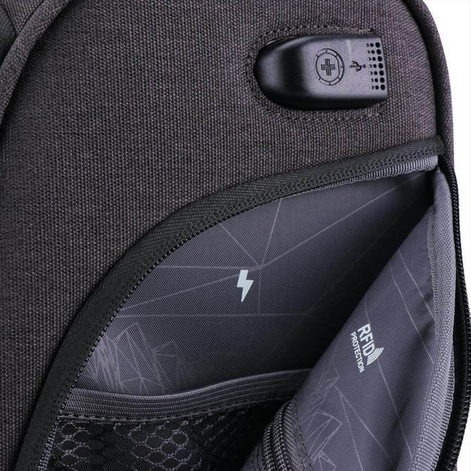 A close-up of a grey wheeled underseat luggage, featuring an interior pocket with a logo and charging port.