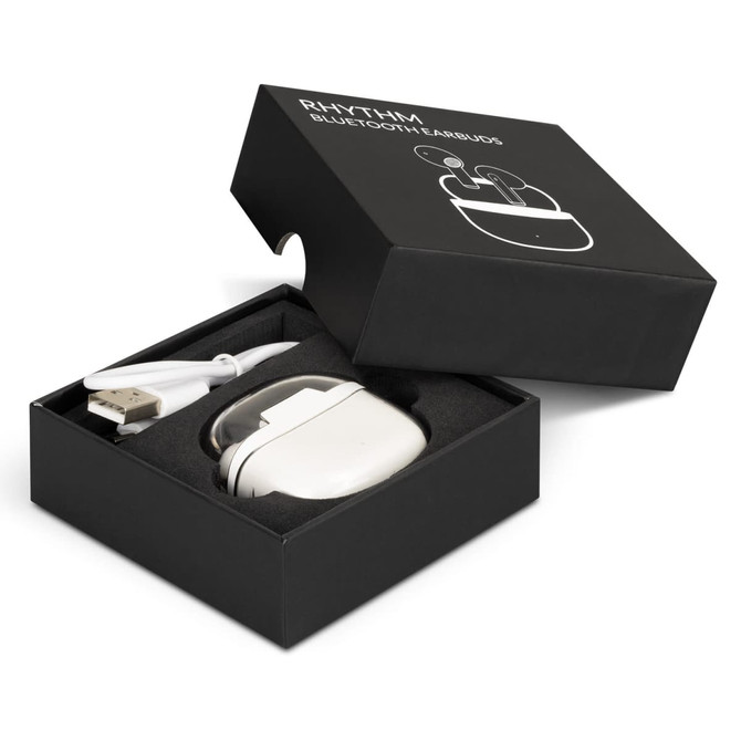 A black box containing white Rhythm Bluetooth earbuds and a USB charging cable. The headset is neatly housed inside the box.