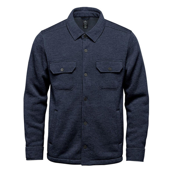 A navy unisex fleece shacket featuring two front pockets and a button-up design. It has a logo on the tag.