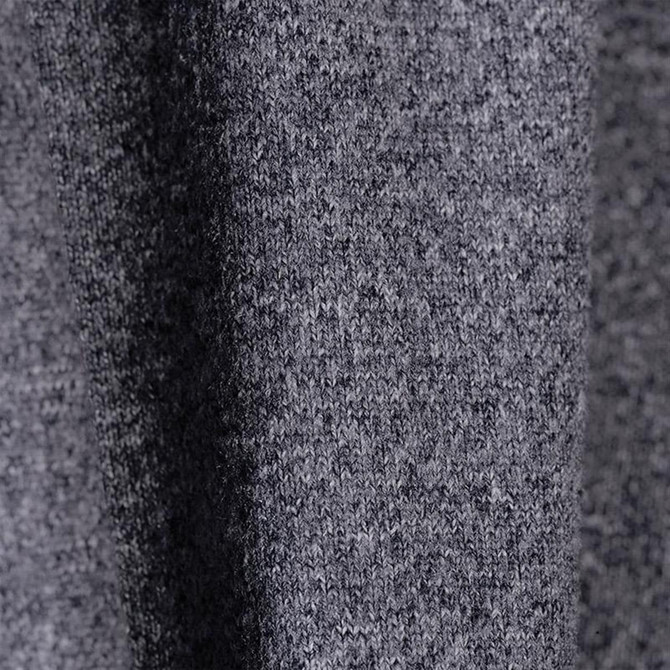 A close-up of a grey textured fabric, showcasing a soft knit material with subtle variations.