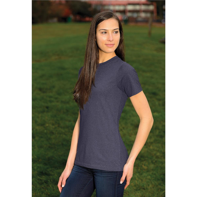 A woman wearing a short-sleeve, navy blue t-shirt in an outdoor setting, featuring a fitted design.