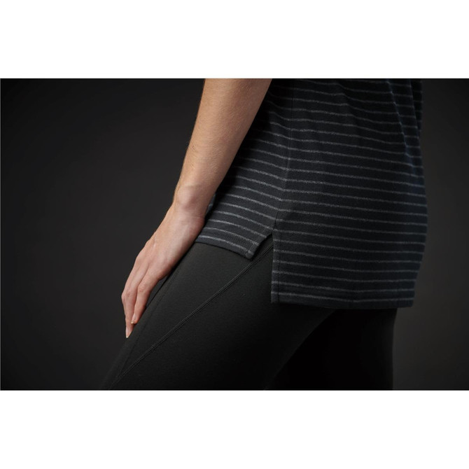 A close-up of a women's crew neck tee featuring grey and black stripes, paired with black leggings.