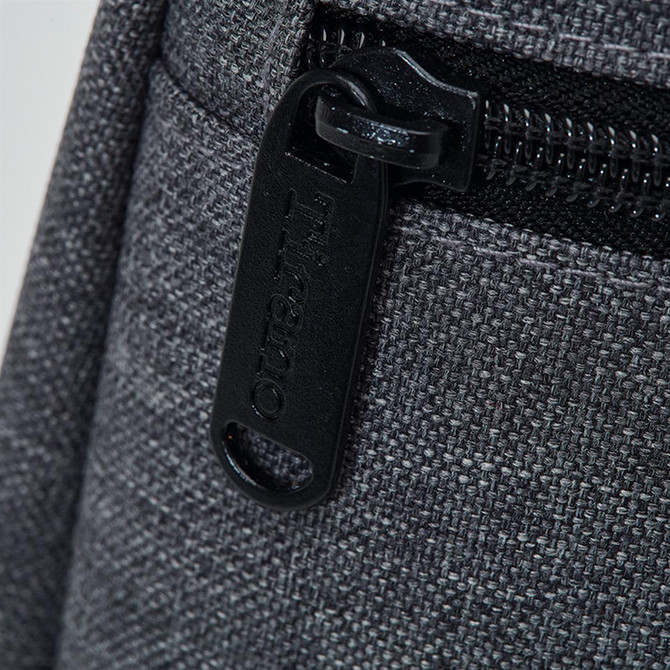 A drink bottle cooler in grey fabric, featuring a zippered compartment and a pull tab with branding.