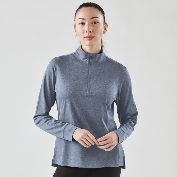 A women's blue 1/4 zip pullover jumper with long sleeves, featuring a subtle texture and a branding logo.