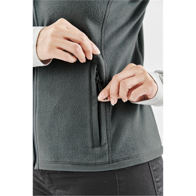 A women's fleece vest in dark green, featuring a zippered side pocket and a soft, textured fabric.