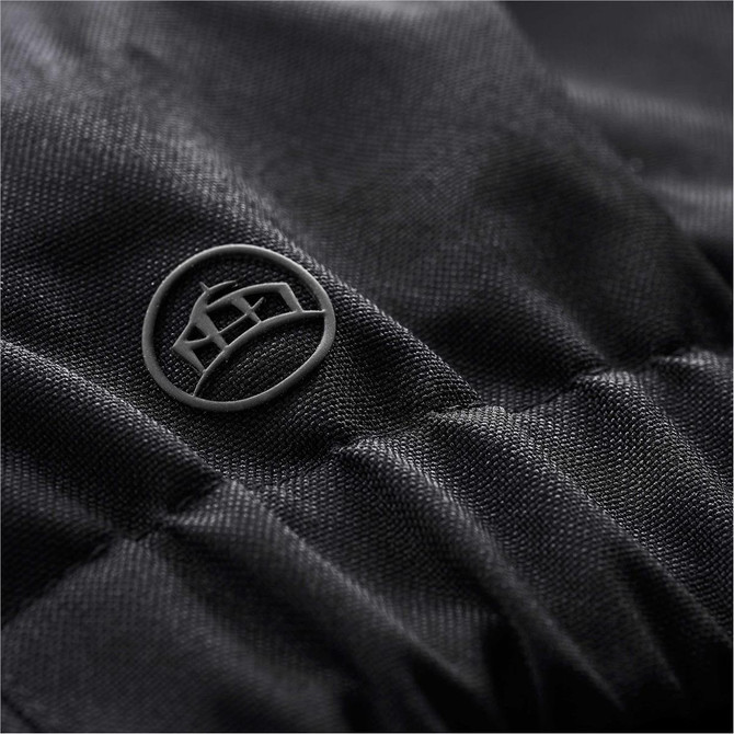A close-up of a black fabric detail featuring a small logo on a Men's Polar HD 3-In-1 Jacket.