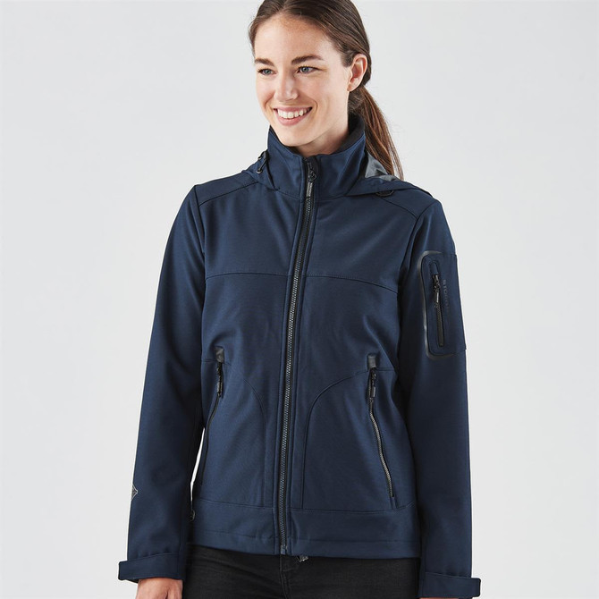 A navy blue women's softshell jacket with a zip front, multiple pockets, and a high collar.