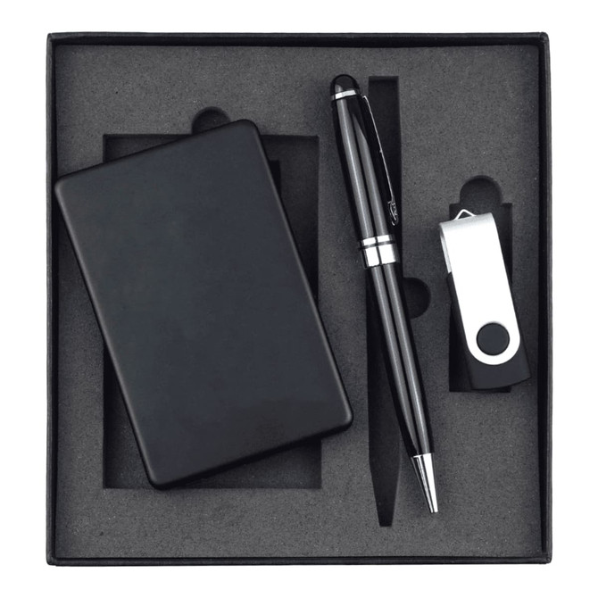 A black power bank, USB drive, and pen arranged in a black gift box. The set is neatly positioned on grey foam.