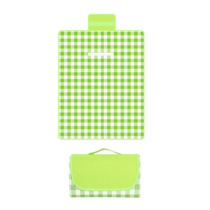 A green and white checkered picnic blanket, folded with a carry handle on top. It features a logo.