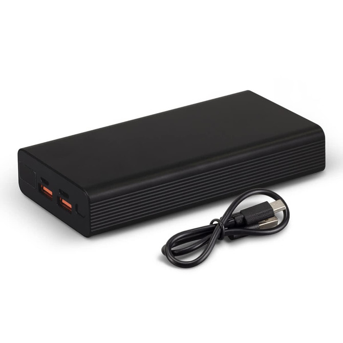 A black power bank with two output ports and a USB charging cable beside it.