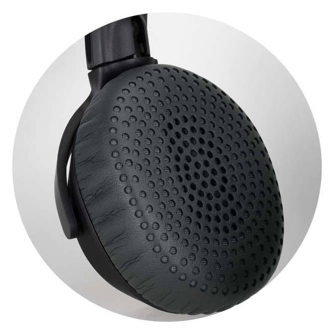 A close-up of a black headphone earcup featuring a textured surface and a circular design pattern.