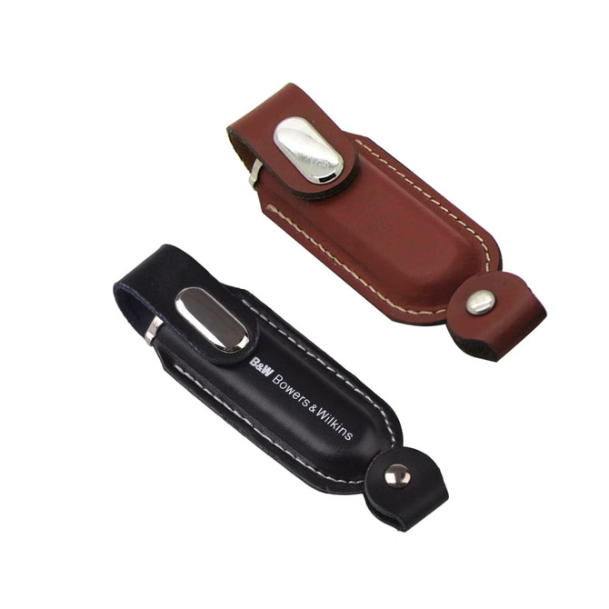 A promotional Venus Flash Drive in brown and black leather cases, featuring a metal button and branding.