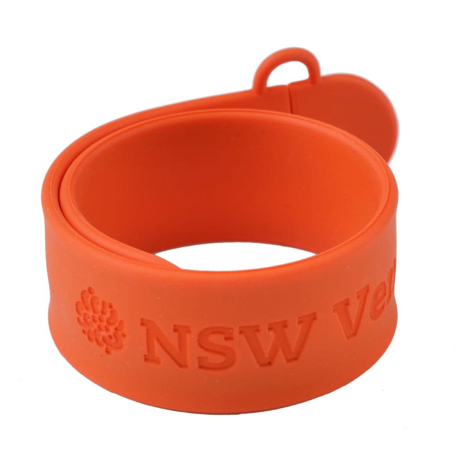 An orange silicone slap band flash drive with a looped end and an embossed logo.