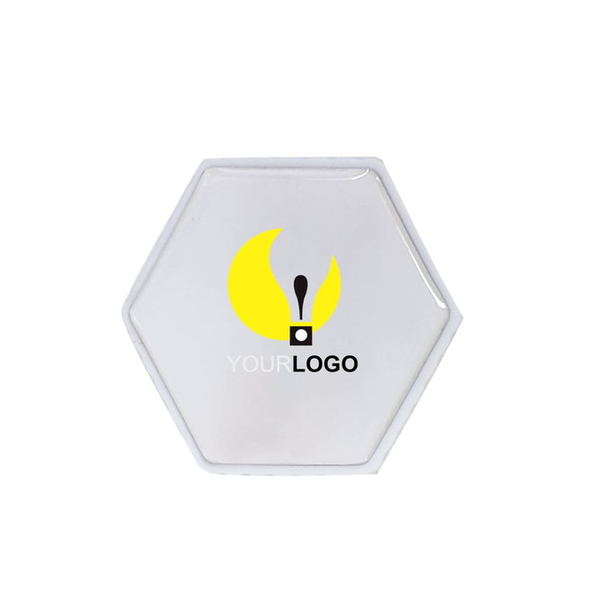 A hexagon-shaped flash drive in a clear design with a logo.