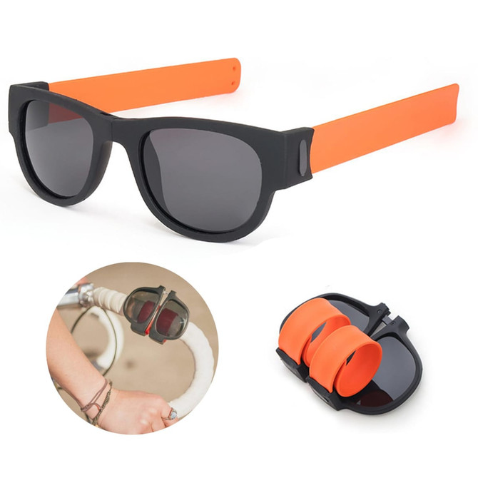 Slap band sunglasses featuring black frames and orange bands, with a compact folding design illustrated below.