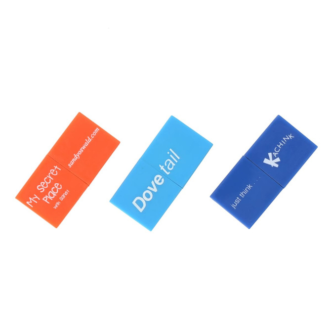 Three brick-shaped flash drives in orange, blue, and dark blue, featuring various logos and branding.