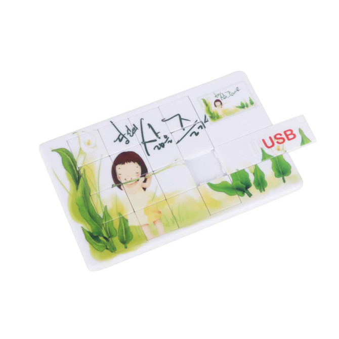 A puzzle-themed USB flash drive featuring colourful illustrations of a girl and green plants, with a branding logo.